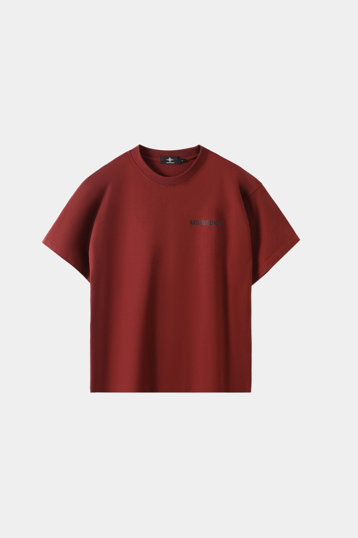 Crimson red oversized T-shirt with small chest logo print, front view on white background.