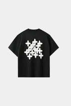 Black oversized T-shirt with black cross-pattern graphic print on chest, front view on white background.