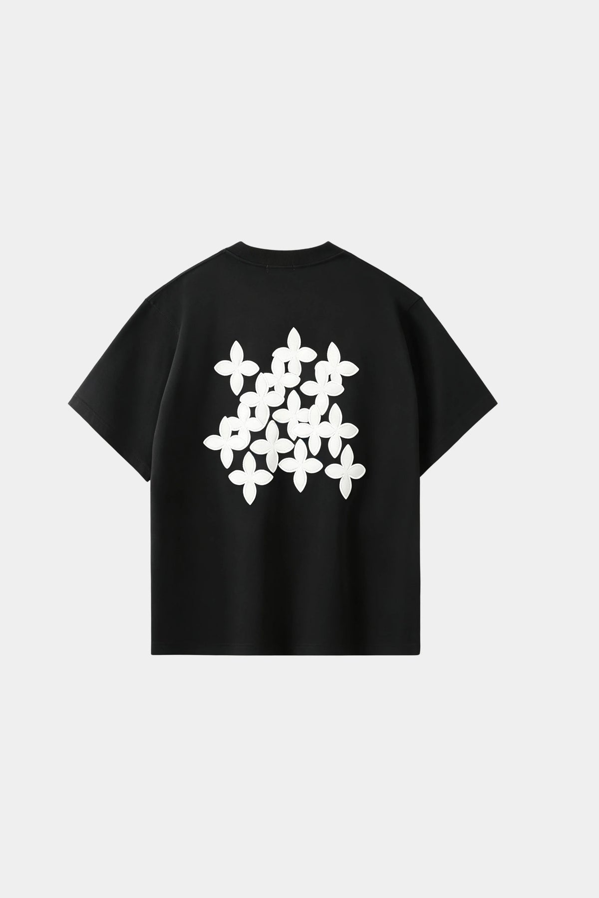 Black oversized T-shirt with black cross-pattern graphic print on chest, front view on white background.