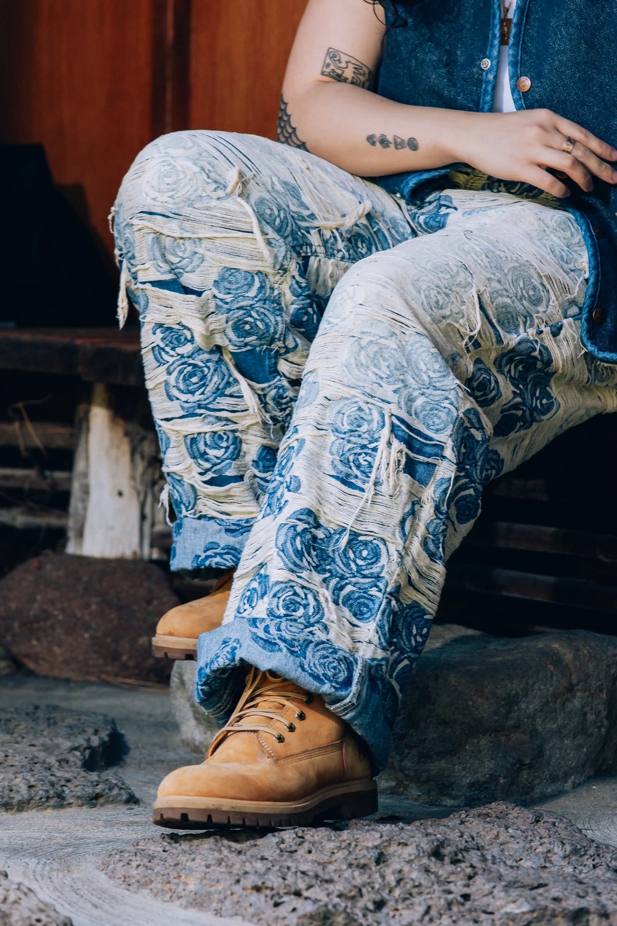 Axis Studios Cultural Denim Jeans - Close-up of Distressed Porcelain Jacquard Jeans showing woven rose pattern and intentional distressing detail