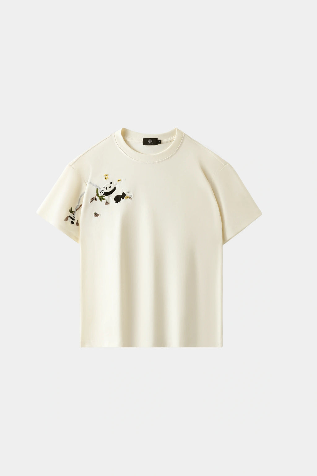 LVORY white oversized T-shirt with hand-embroidered panda and bamboo branch design across chest and sleeve, front view on white background.