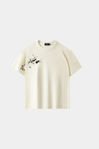 LVORY white oversized T-shirt with hand-embroidered panda and bamboo branch design across chest and sleeve, front view on white background.