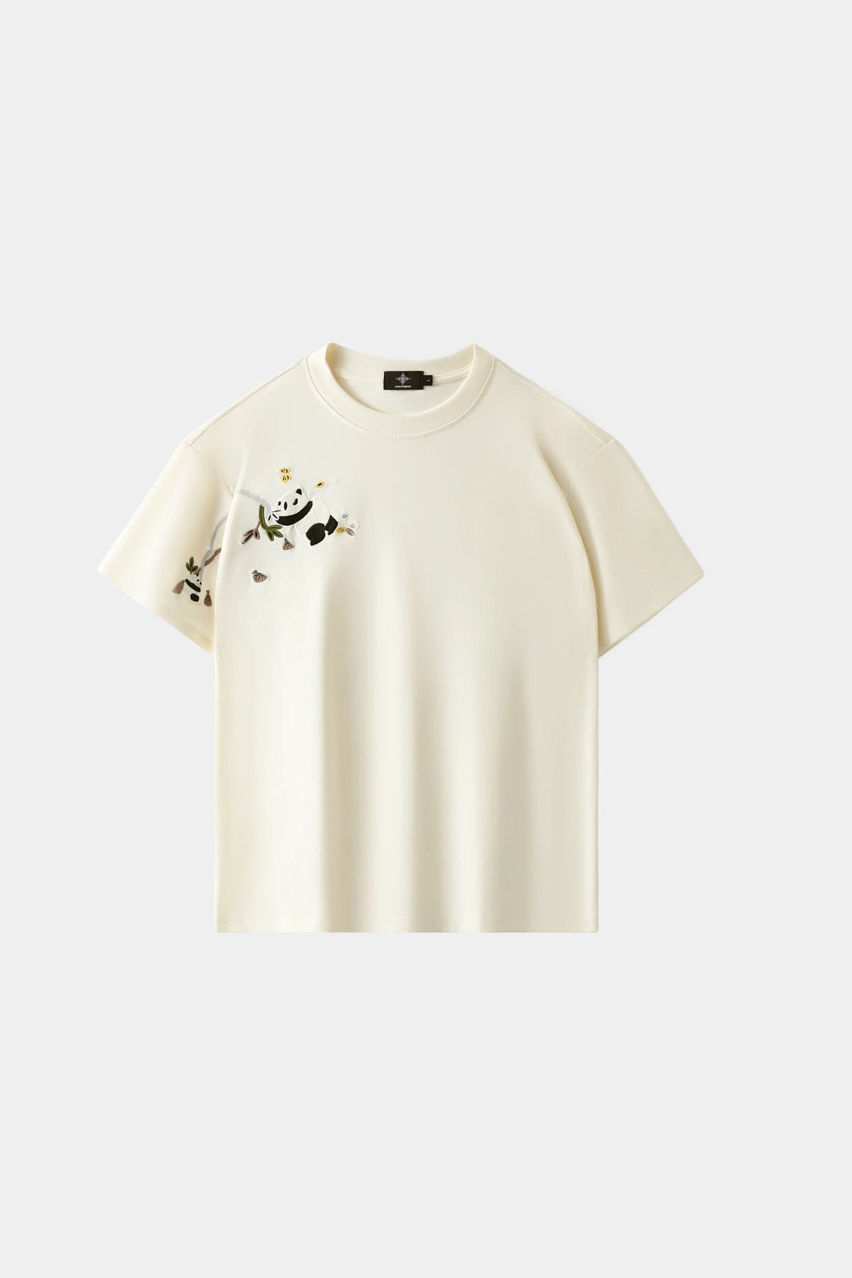LVORY white oversized T-shirt with hand-embroidered panda and bamboo branch design across chest and sleeve, front view on white background.