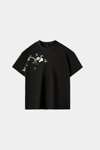 Obsidian black oversized T-shirt with hand-embroidered panda and bamboo branch design across chest and sleeve, front view on white background.