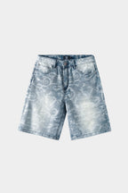 Light blue denim jeans with blue-white porcelain rose jacquard pattern and heavy distressing, wide-leg fit, front view on white background.