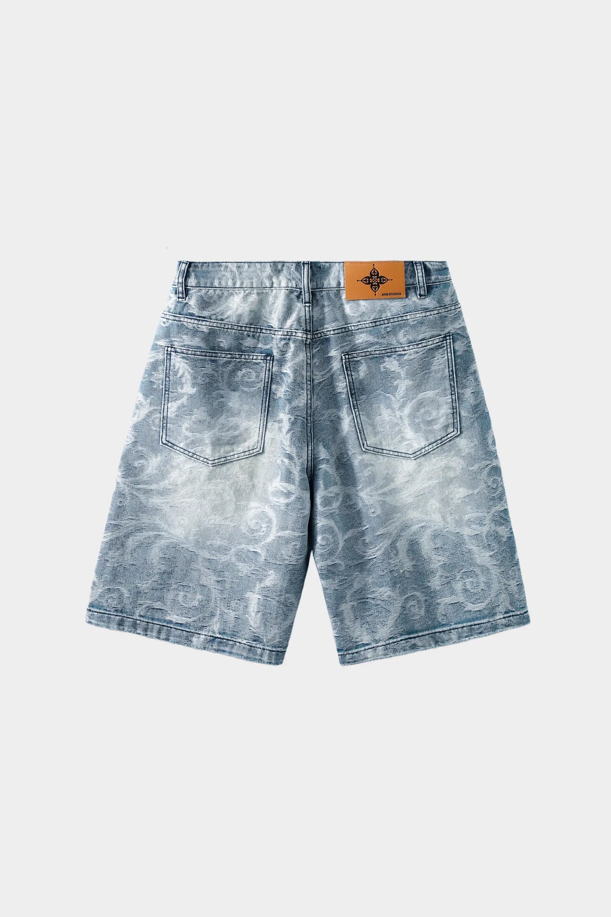 Light blue jeans with a blue and white porcelain rose jacquard pattern and a heavily distressed finish; wide-leg style; reverse side with white background.